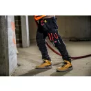 MILWAUKEE FREEFLEX™ Pantaloni de lucru universali negri 245 g/m² / 52 W36/L32
